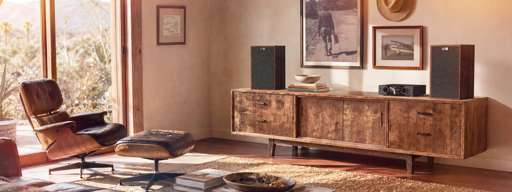Klipsch Rebellion Premium Bookshelf Loudspeakers on attractive media console in sun soaked living room