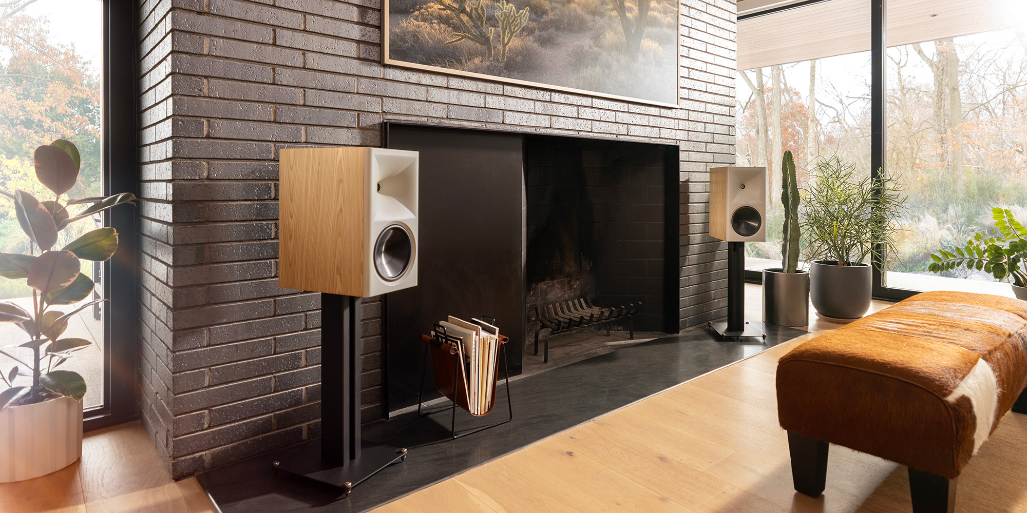 Klipsch The Nines II in Red Oak in front of tv in spacious and bright living room